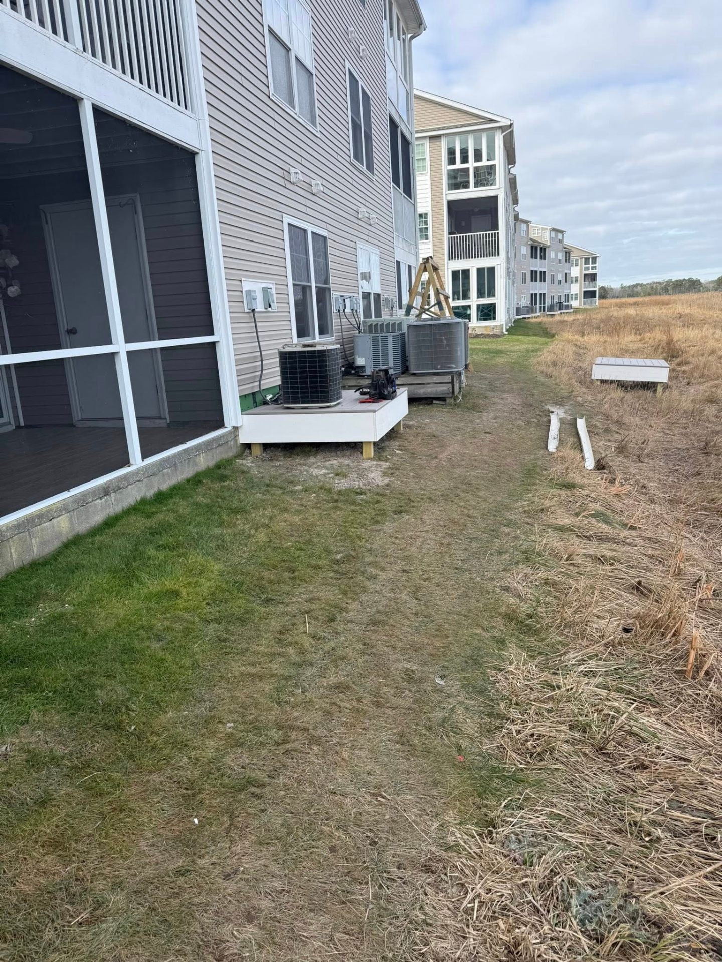 AC condensers on elevated platforms at coastal condos