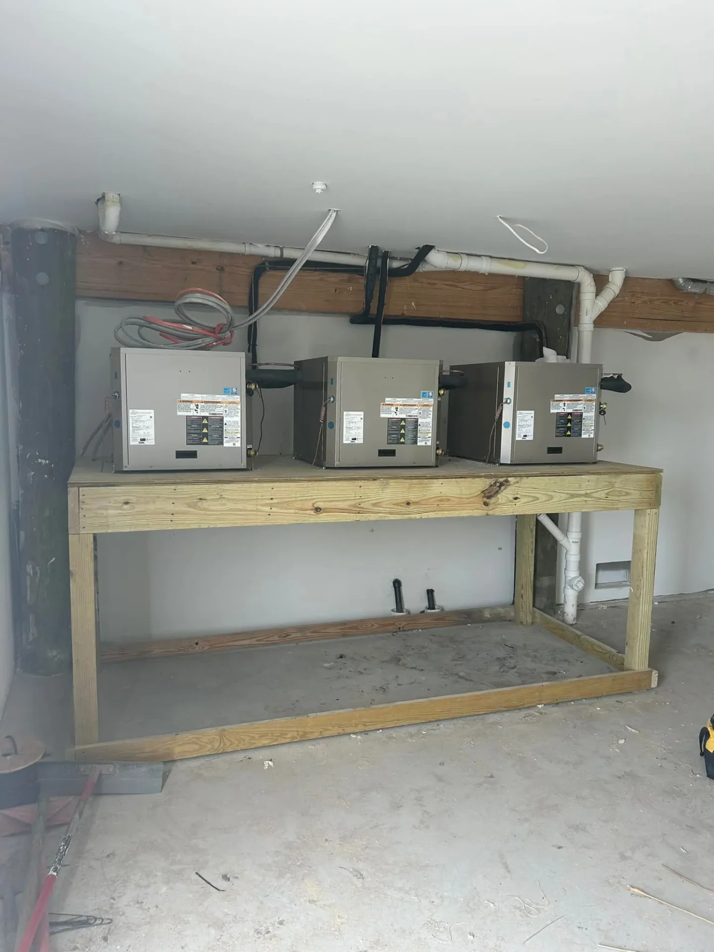 Three air handlers on custom wood platform