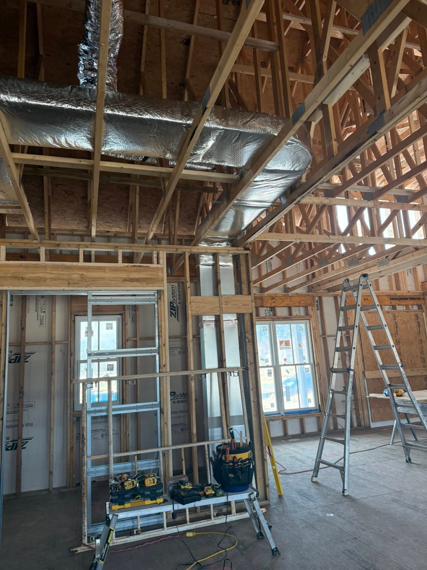 Insulated ductwork routed through new construction framing