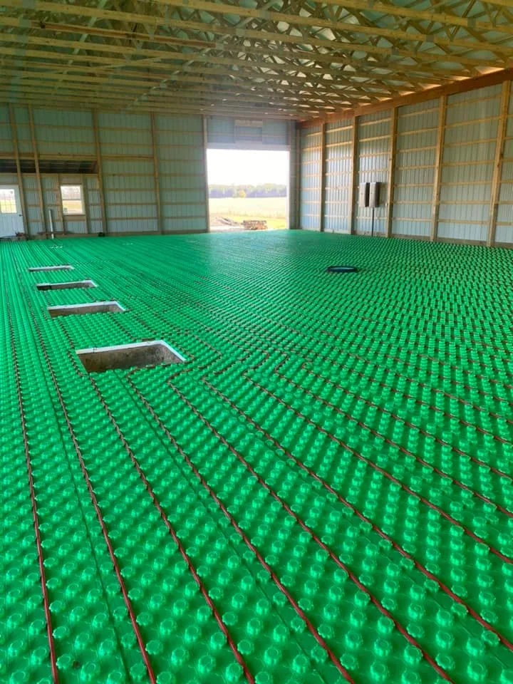 Radiant floor heating PEX tubing in commercial barn